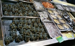 The things on the left are crabs tied with colorful strings, the rest I am not sure about.